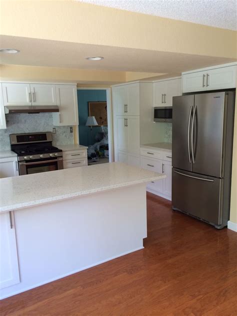 After- kitchen reno. Bar pulls, white cabinets. Carrara subway tile ...