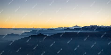 Premium Photo | Sunrise at snowy mountains