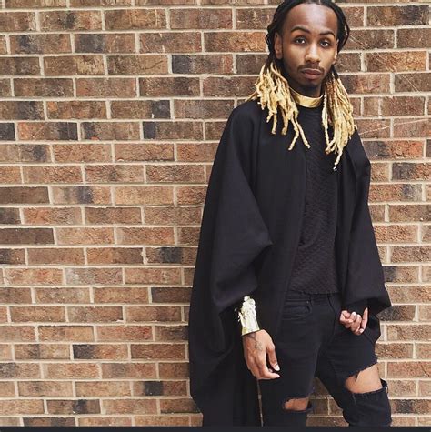 Bleach blonde dread tips, dressed in all black. We love Qaysean-Roe ...