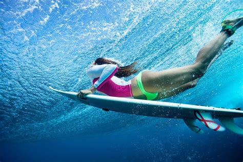 Photo @Justinlewisontheroad | Duck diving a wave in the pristine waters ...