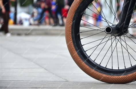 Premium Photo | A bmx bike wheel against a blurred street with cycling ...