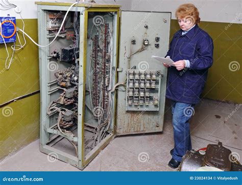 Woman Engineer in Machine Room (elevator) Stock Photo - Image of device ...