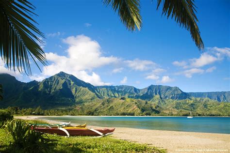 Hawaii, Kauai, Hanalei Bay, Outrigger canoes on resort beach. | Hawaii ...