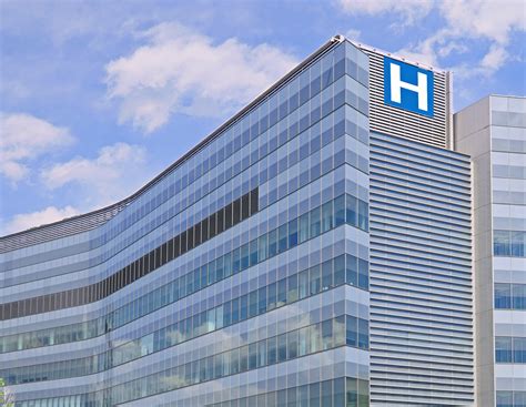 Building with large H sign for hospital - XINSURANCE