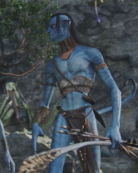 an image of a man with blue paint on his face and body holding two swords