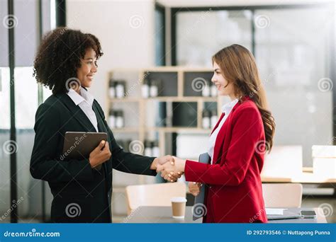 Business People Shaking Hands during a Meeting in Office Stock Photo ...