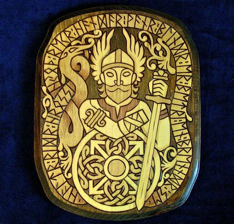 Tyr the one-handed Viking god with inscription in Runes wood