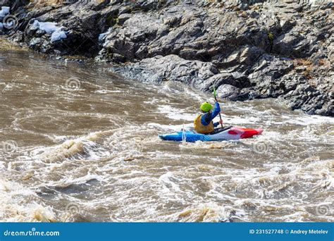 Multi-colored Kayak in the Waters of a Turbulent Mountain River. the ...