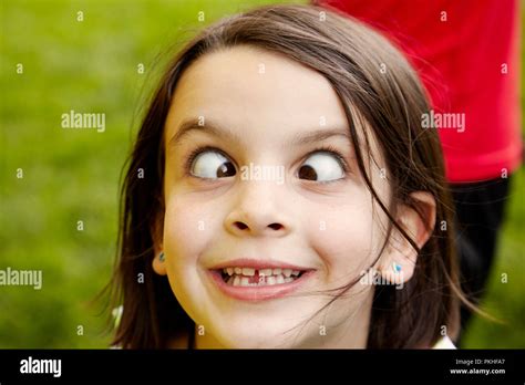 little girl playing and making funny faces Stock Photo - Alamy