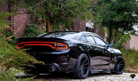 Blacked Out Dodge Charger with Contrasting Red Calipers and Accents ...