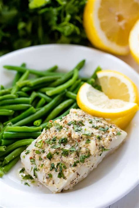 Easy Baked Cod Fish is smothered in a lemon garlic parmesan mixture ...