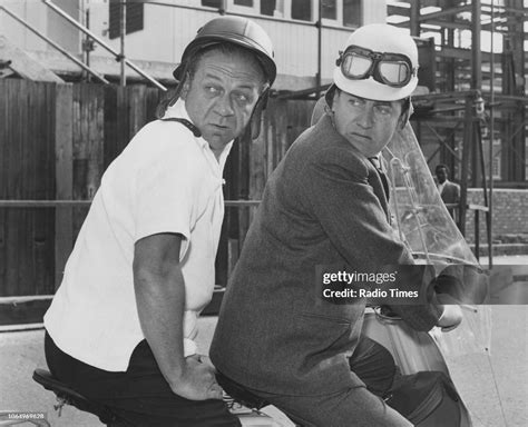 Actors Sid James and Tony Hancock riding a bike in a scene from the ...