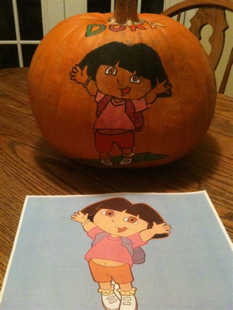 A Halloween pumpkin with Dora painted on it. Dora The Explorer ...