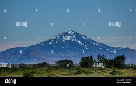 The infamous Hekla volcano towers above the landscape of South Iceland ...