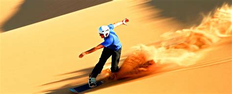 Sandboarding and skiing on Dubai desert