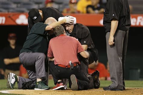 MLB umpire struck in head by a bat during A's-Angels game - syracuse.com