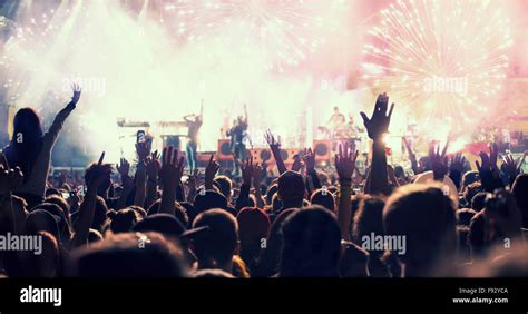 Cheering crowd and fireworks at New Year's Eve Stock Photo - Alamy