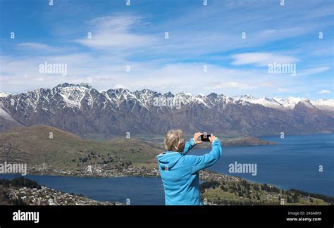 Lake Wakatipu, Queenstown , New Zealand. Tourists enjoy activities on ...