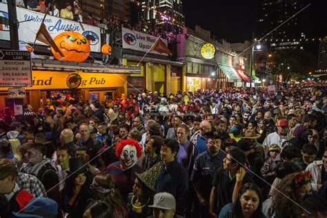 Costume revelers haunt the packed streets of 6th Street on Halloween in ...