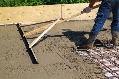 Worker Leveling Fresh Concrete Slab with Special Working Tool Stock ...