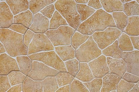 Limestone stone wall texture and background, beige golden limestone ...