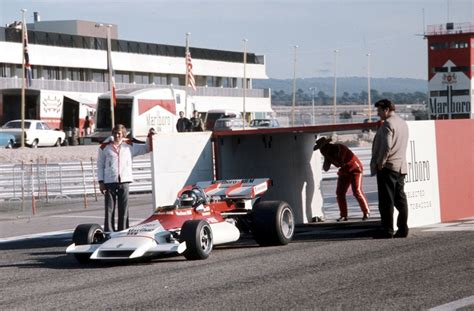 Marlboro branded BRM F1 car emerging from a mock-up of a giant Marlboro ...