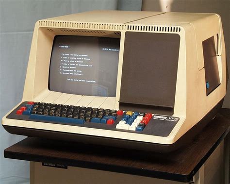 an old computer sitting on top of a table