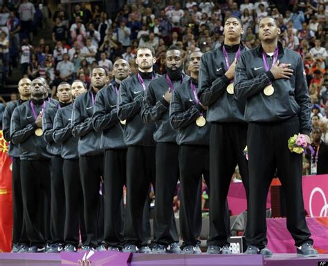 Gold Medal Match Members of USA's men's basketball team listen to the ...