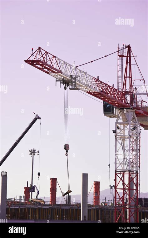 Cranes on construction site Stock Photo - Alamy