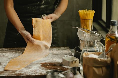 Chef making fresh pastry on table in bakery · Free Stock Photo