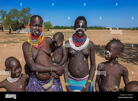 Women of the tribe of the Karo with face painting and necklace, Karo ...