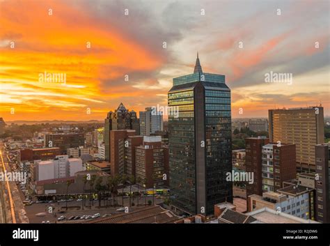 A sunset is seen over the Harare city skyline in Zimbabwe Stock Photo ...