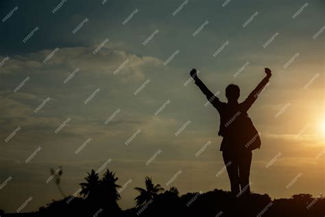 Premium Photo | Silhouette of woman pointing with finger in sky