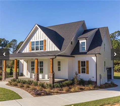 White Farmhouse Exterior With Stone