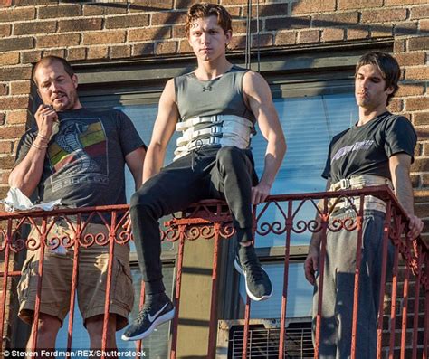 Tom Holland dangles off a balcony while performing stunts for Spider ...