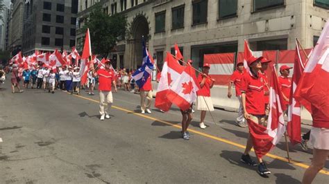 Montreal Canada Day parade marches ahead despite heat warning | CBC News