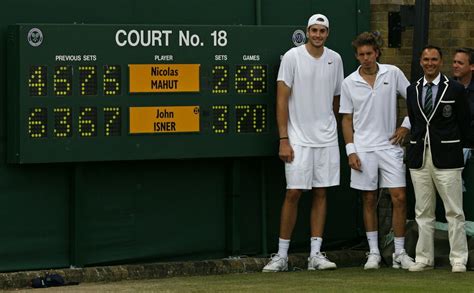 John Isner of the US , France's Nicolas Mahut , and chair umpire ...