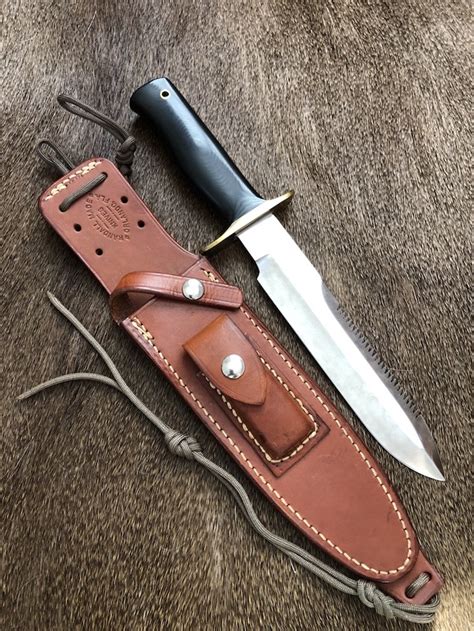 Randall Knives USA: Model 14 Attack with Saw Back And Black Micarta Handle