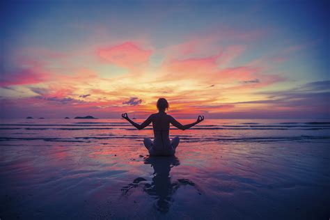 Woman doing meditation near the ocean beach. Yoga silhouette. * Alisoun ...