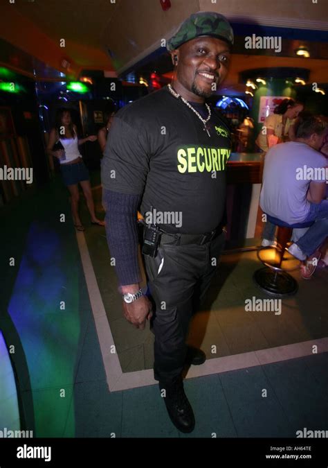 Security bouncer hard man in club Stock Photo - Alamy