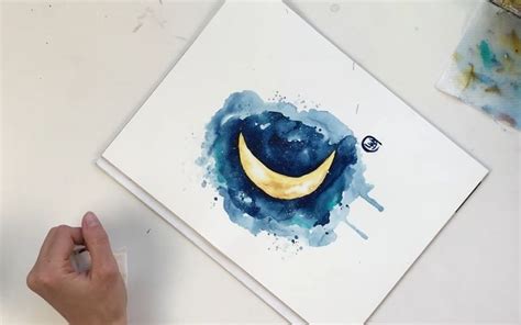 a person is working on a painting with watercolors