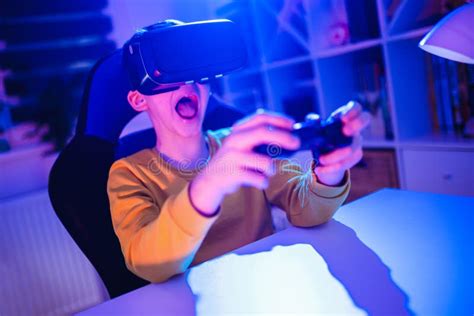 Boy Playing Video Game Using Vr Glasses in the Dark Room Stock Photo ...