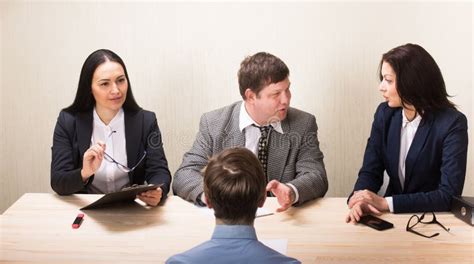 Young Man during Job Interview and Members of Management Stock Photo ...