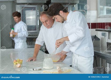 Apprentice Chef Preparing Food in Kitchen at Restaurant Stock Photo ...