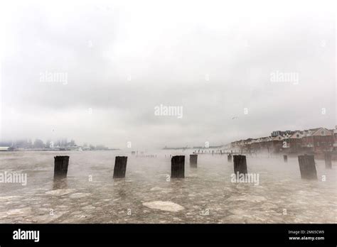 Hudson river in Winter with Misty New Your Cityscape in Background ...