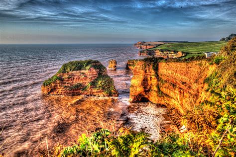 English Jurassic coast Sandstone rock stacks Ladram Bay Devon England ...