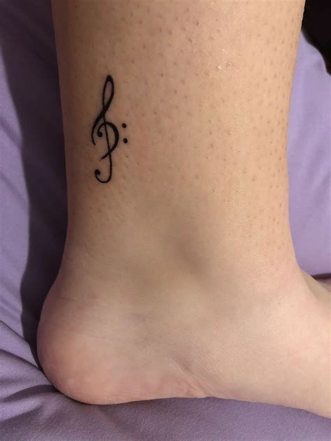 Treble & bass clef tattoo | Music tattoo designs, Tattoos, Ankle foot ...