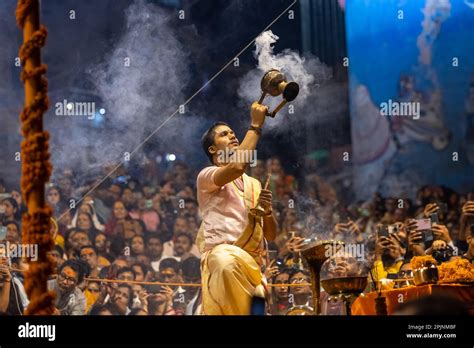 Ganga aarti, Portrait of an young priest performing river ganges ...