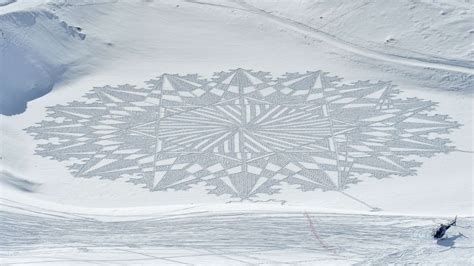 Artist creates massive murals in snow all over the world using just his ...