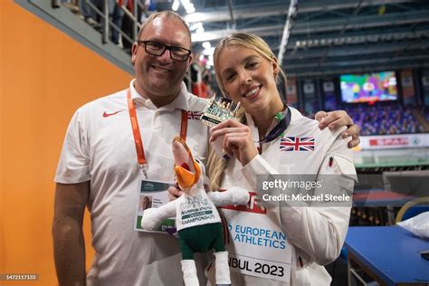 Keely Hodgkinson poses with her coach, Trevor Painter, after... News ...